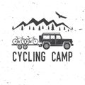 Vintage typography design with car and trailer, mountain bikes and mountain silhouette.