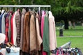 Vintage used and new clothes for sale in the stall stand at the flea market Royalty Free Stock Photo