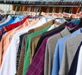 vintage used and new clothes for sale in the stall stand at the flea market Royalty Free Stock Photo