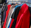 Vintage used and new clothes for sale in the stall stand at the flea market Royalty Free Stock Photo