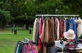 vintage used and new clothes for sale in the stall stand at the flea market Royalty Free Stock Photo