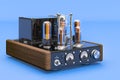 Vintage vacuum tube amplifier on blue backdrop, 3D rendering