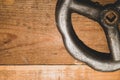 Vintage valve on wooden background. steel wheel valve on the table