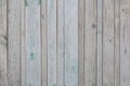 Vintage vertical gray colour wooden boards with remains paint as background