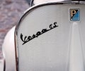 Vintage Vespa Gs logo, iconic italian scooter of the Sixties, with raindrops.