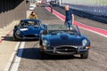 Vintage veteran car Jaguar E-Type competition roadster stands on race track Royalty Free Stock Photo