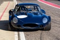 Vintage veteran car Jaguar E-Type competition roadster stands on race track Royalty Free Stock Photo