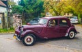 Vintage veteran car purple red Citroen 15 driving