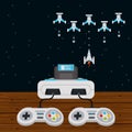 Vintage videogame console with aliens spaceship