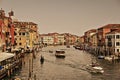 Vintage view of Canal Grande in Venice with lots of boats and historic houses. Venice, Italy - 25/08/2017