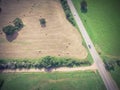 Vintage view Texas farmland prairie field bale hay on sunny day Royalty Free Stock Photo