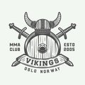 Vintage vikings motivational logo, emblem, badge in retro style.