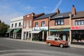 Vintage village high street shops with vintage car, Black Country Museum