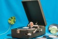 Vintage vinyl record player with monsters leaf. Vinyl records on background. Retro concept Royalty Free Stock Photo