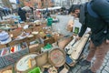 Vintage violin and musician looking vintage instruments at flea market with antique stuff, retro furniture and decor