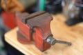 Vintage vise on workbench in garage