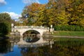 Vintage Viskontiev bridge in the autumn landscape. Pavlovsk Palace Park. Saint-Petersburg