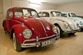 Vintage VW Beetle cars in a car museum