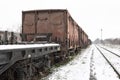 Old wagons on the railway in the snow in winter. Royalty Free Stock Photo