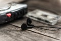 Vintage walkman cassette player with earbuds and tape cassette Royalty Free Stock Photo