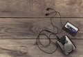 Vintage walkman cassette player with earbuds and tape cassette Royalty Free Stock Photo