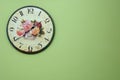 Vintage wall clock on the green wall Royalty Free Stock Photo