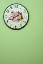 Vintage wall clock on the green wall Royalty Free Stock Photo