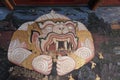 Vintage wall drawing depicting a monster devouring people. Ramayana illustration