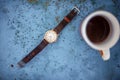 Gold/silver vintage wrist watch with brown leather bracelet.