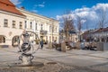 Vintage water pump with large wheel on main city square in Kielce