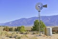 Vintage Water pump / Windmill in Rural landscape