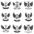 Vintage Weapon Emblems set. Heraldic signs vector vintage elements collection. Royalty Free Stock Photo