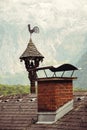 Vintage weathercock on the roof of old house in Hallstatt village, Austria