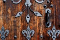 vintage weathered rustic oak door with decorative black forged iron pattern Royalty Free Stock Photo