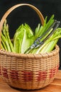 Vintage weaved reed basket of organic home grown vegetables