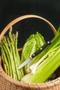 Vintage weaved reed basket of organic home grown vegetables Royalty Free Stock Photo