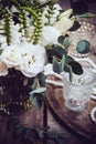 Vintage wedding decor, bouquet of white flowers and candles Royalty Free Stock Photo