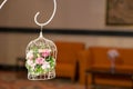 Vintage wedding decorative birdcage with flowers