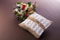 Vintage wedding pillow with ring and bouquet Royalty Free Stock Photo