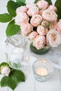 Vintage wedding table decorations with roses, candles cutlery Royalty Free Stock Photo