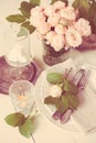 Vintage wedding table decorations with roses, candles cutlery Royalty Free Stock Photo