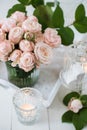 Vintage wedding table decorations with roses, candles cutlery Royalty Free Stock Photo