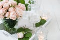 Vintage wedding table decorations with roses, candles cutlery Royalty Free Stock Photo