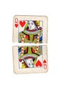 A vintage queen of hearts playing card torn in half. Royalty Free Stock Photo