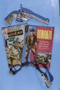 Vintage western comic books and child`s gun and spurs