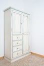 Vintage white armoire furniture in house