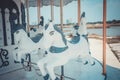 Vintage white carousel horse was abandoned in near urban area. It reminded the childhood happiness which children can play in Royalty Free Stock Photo