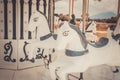 Vintage white carousel horse was abandoned in near urban area. It reminded the childhood happiness which children can play in Royalty Free Stock Photo