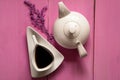 Vintage white ceramic teapot and cup of tea on a glamorous background Royalty Free Stock Photo