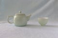 Vintage white ceramic teapot and teacup, tea set or living utensils, antique Royalty Free Stock Photo